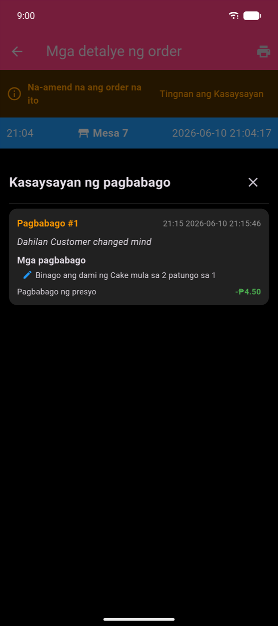 Screen ng mga detalye ng order na may orange na banner na 'This order has been amended' at link na View History; asul na header na nagpapakita ng 21:04, Table 7, 2026-06-10 21:04:17; bottom sheet ng Kasaysayan ng mga Amendment na nagpapakita ng Amendment 1 na may dahilang 'Customer changed mind', pagbabago na 'Changed quantity of Cake from 2 to 1', at Price Change: −₱4.50 sa berde